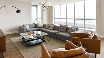 Contemporary living room with floor to ceiling windows